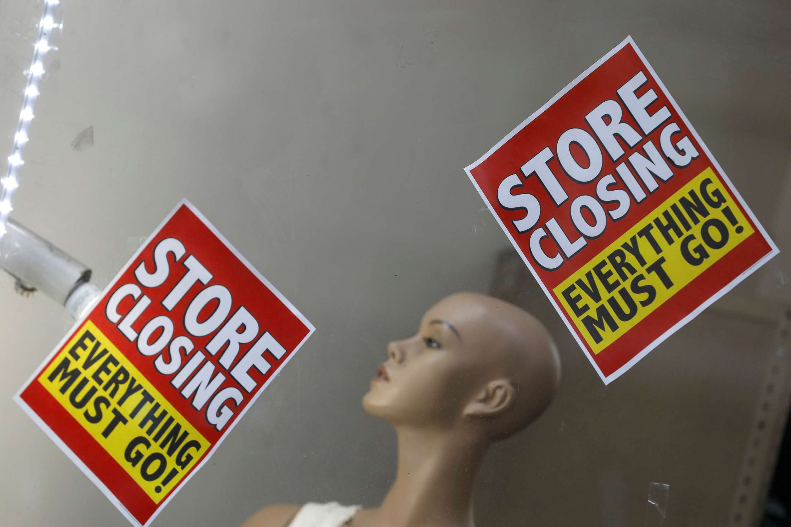 PHOTO: Signage is seen advertising a sale at a store that is closing in Manhattan, New York City, Aug. 17, 2020.