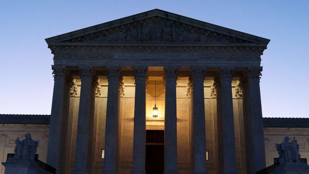 PHOTO: The U.S. Supreme Court is seen before sunrise on Capitol Hill in Washington, March 21, 2022.