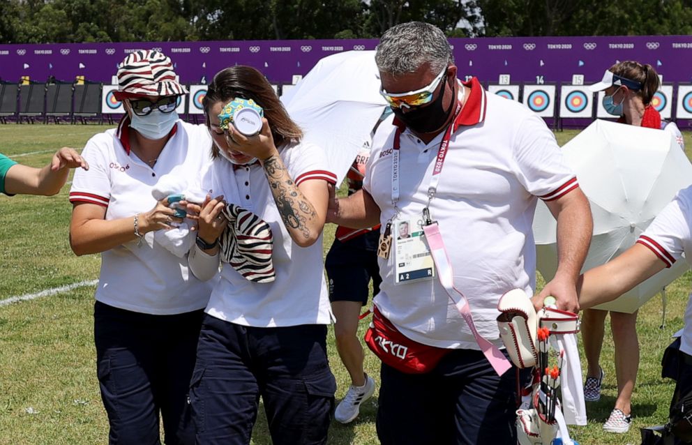 PHOTO: Svetlana Gomboeva of Team ROC is treated for heat exhaustion in the Women's Individual Ranking Round during the Tokyo 2020 Olympic Games at Yumenoshima Park Archery Field on July 23, 2021 in Tokyo.