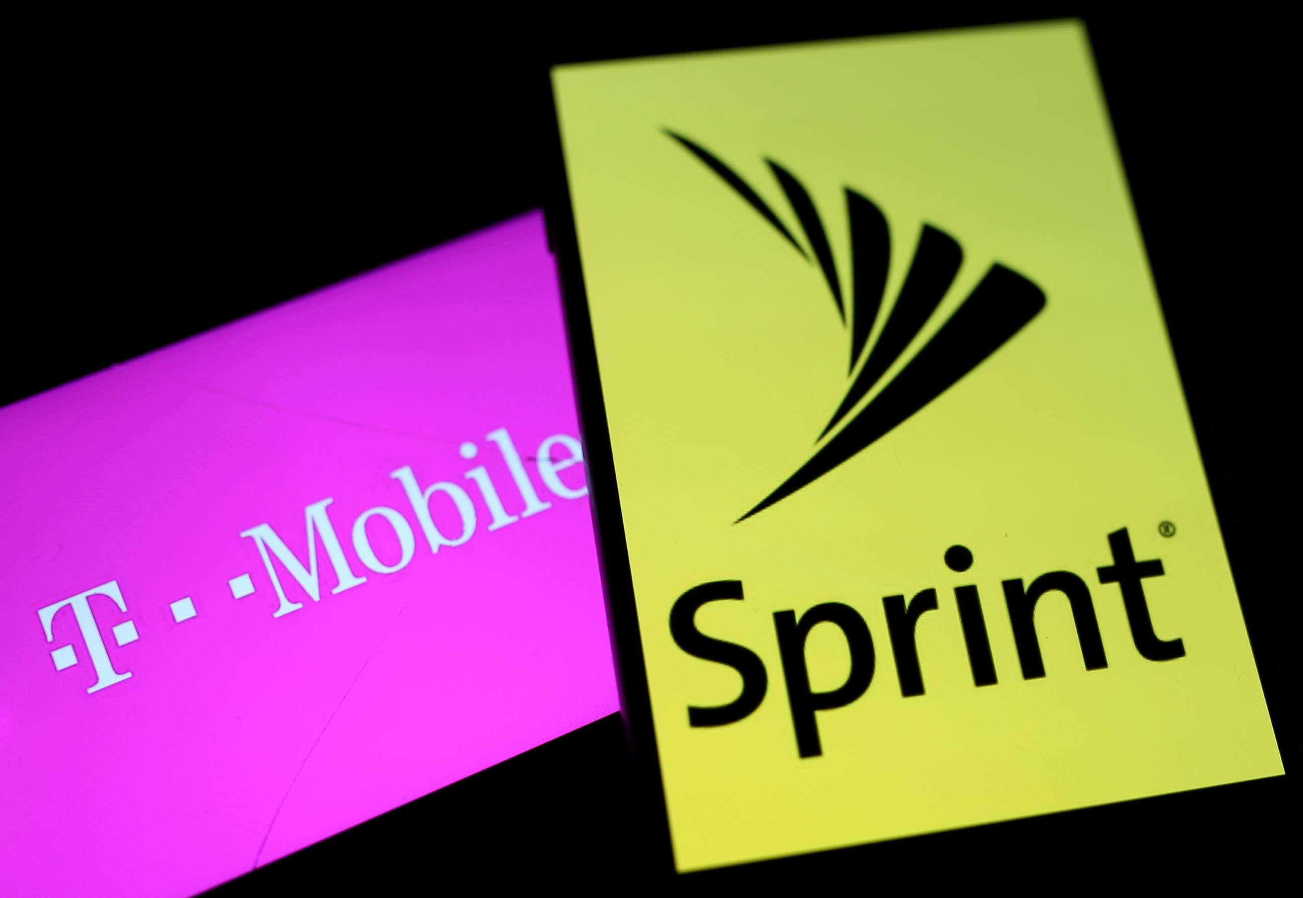 PHOTO: An illustration depicts smartphones with the logos of T-Mobile and Sprint, Sept. 19, 2017. 