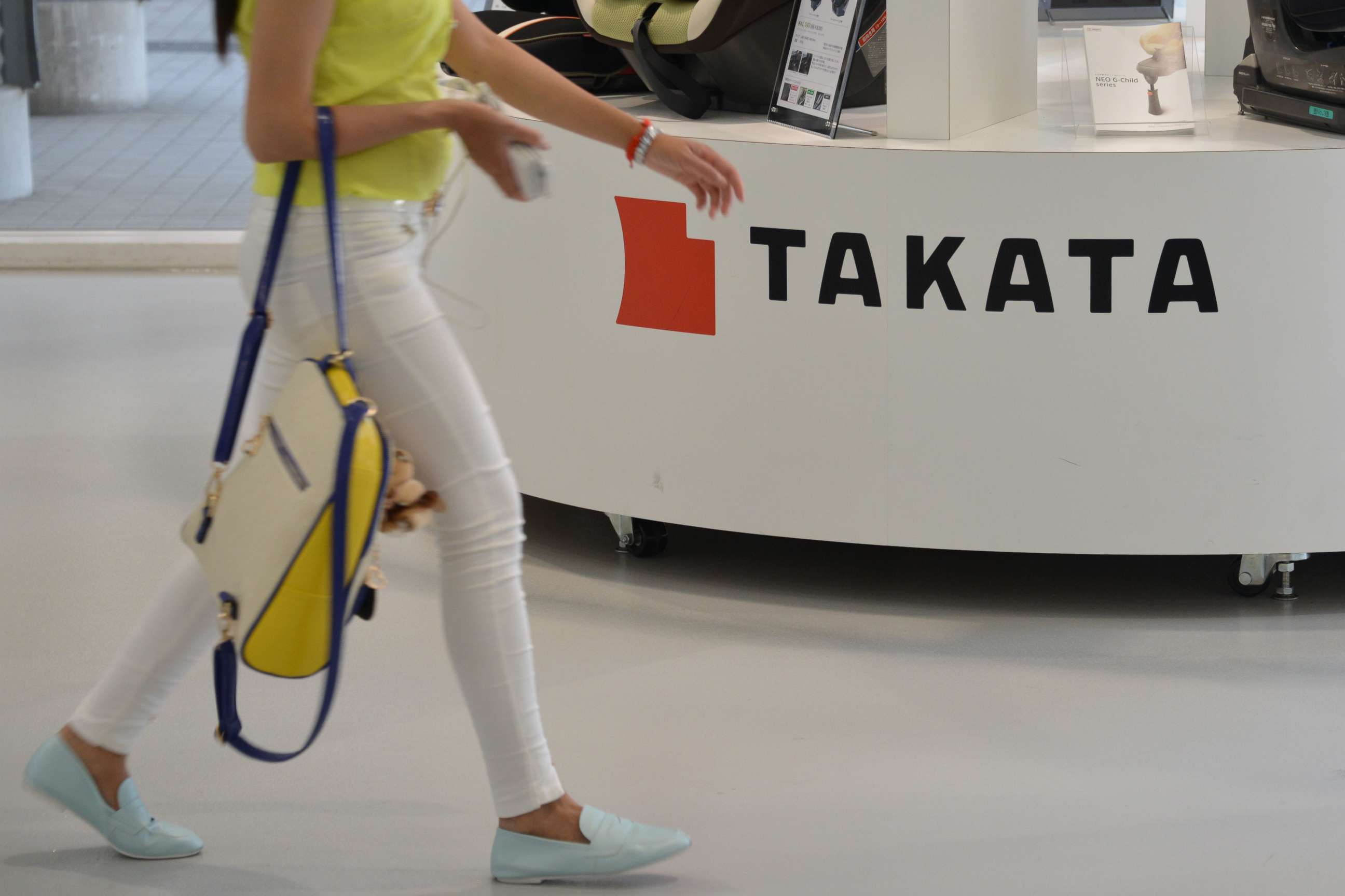 PHOTO: A visitor walks past displays of Takata Corp at a showroom for vehicles in Tokyo, May 20, 2015.