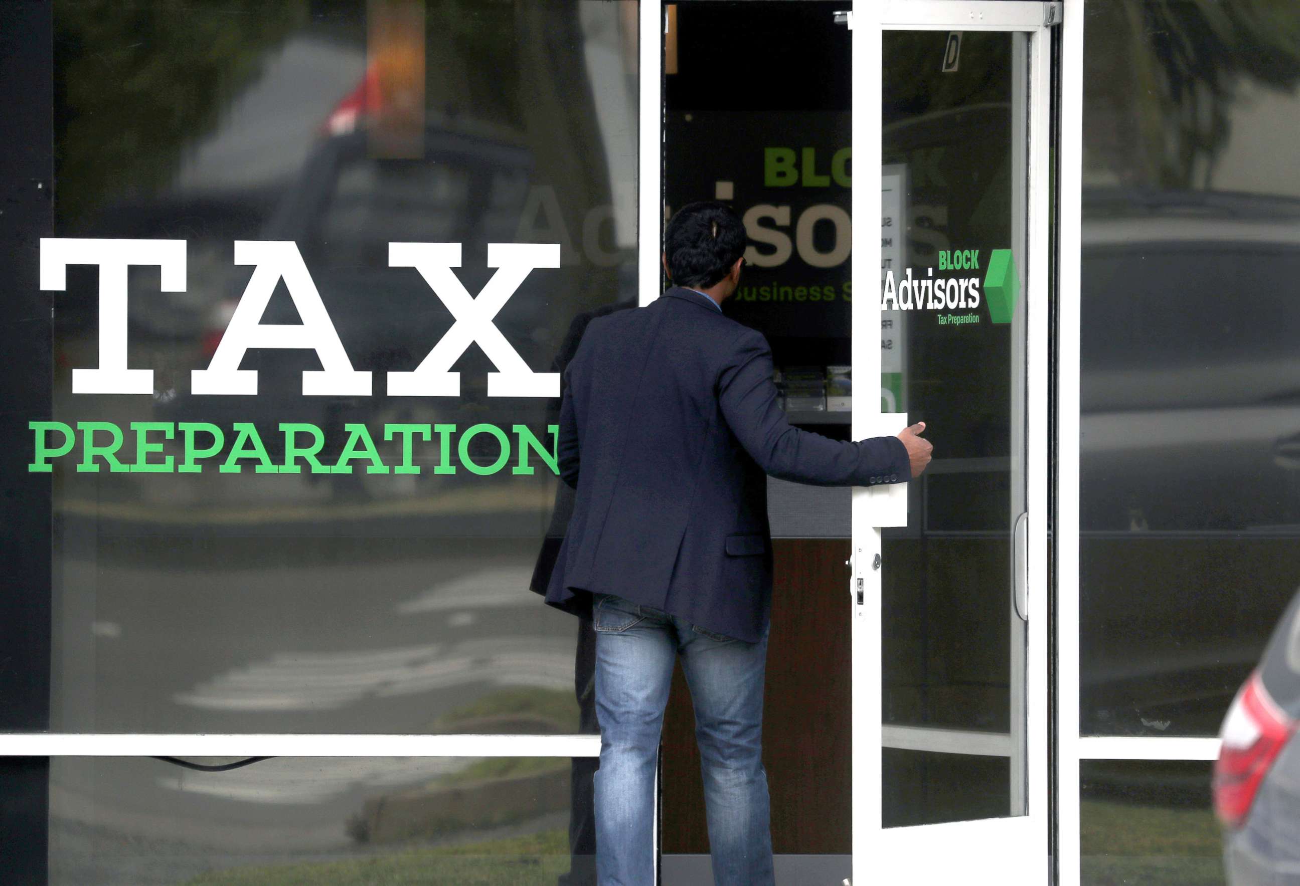 PHOTO: A customer enters a Block Advisors tax preparation office in San Anselmo, Calif., April 15, 2019.