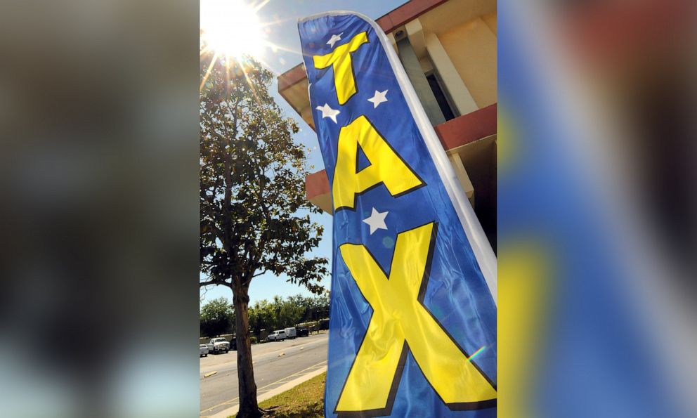 PHOTO: A sign is seen outside a tax preparation office in Kissimmee, Fla., April 15, 2019.