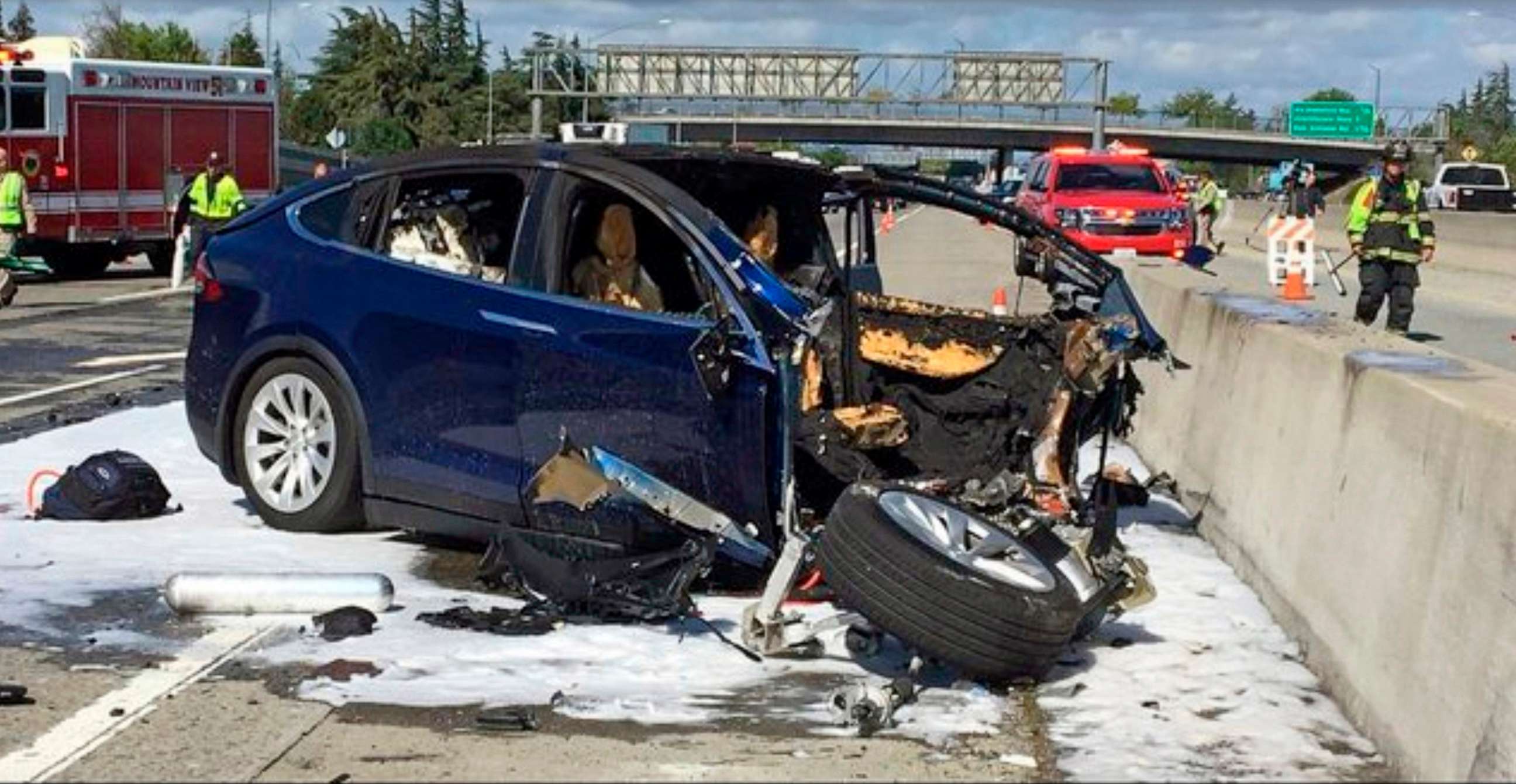 PHOTO: In this March 23, 2018 photo provided by KTVU, emergency personnel work a the scene where a Tesla electric SUV crashed into a barrier on U.S. Highway 101 in Mountain View, Calif.