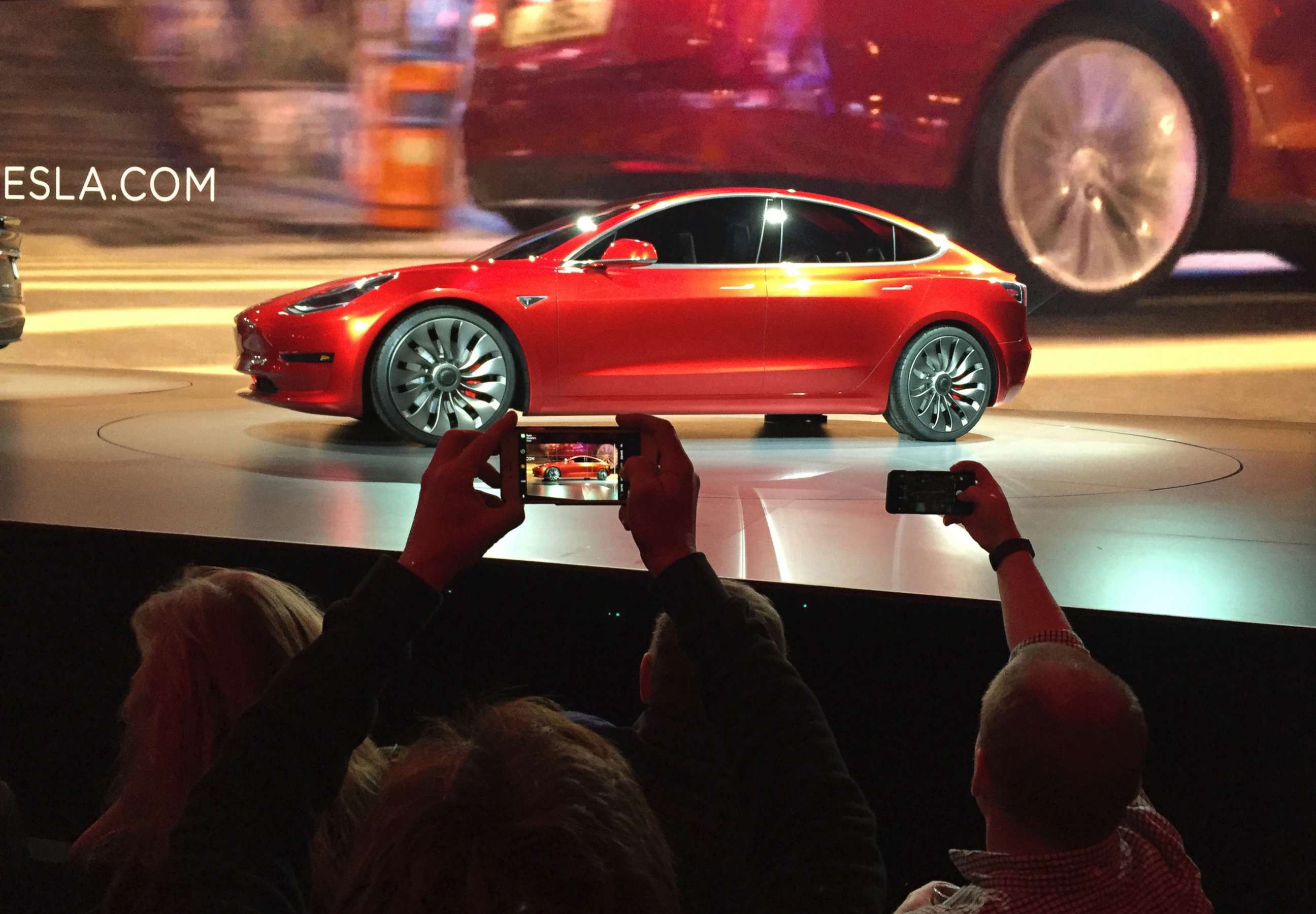 PHOTO: Tesla Motors unveils the new lower-priced Model 3 sedan at the Tesla Motors design studio in Hawthorne, Calif., March 31, 2016.