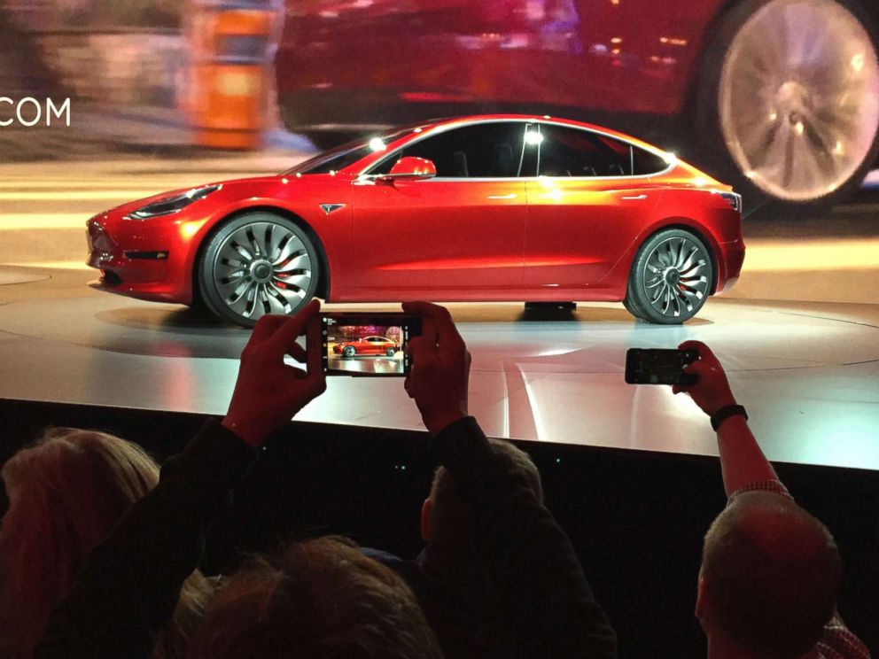 PHOTO: Tesla Motors unveils the new lower-priced Model 3 sedan at the Tesla Motors design studio in Hawthorne, Calif., March 31, 2016.