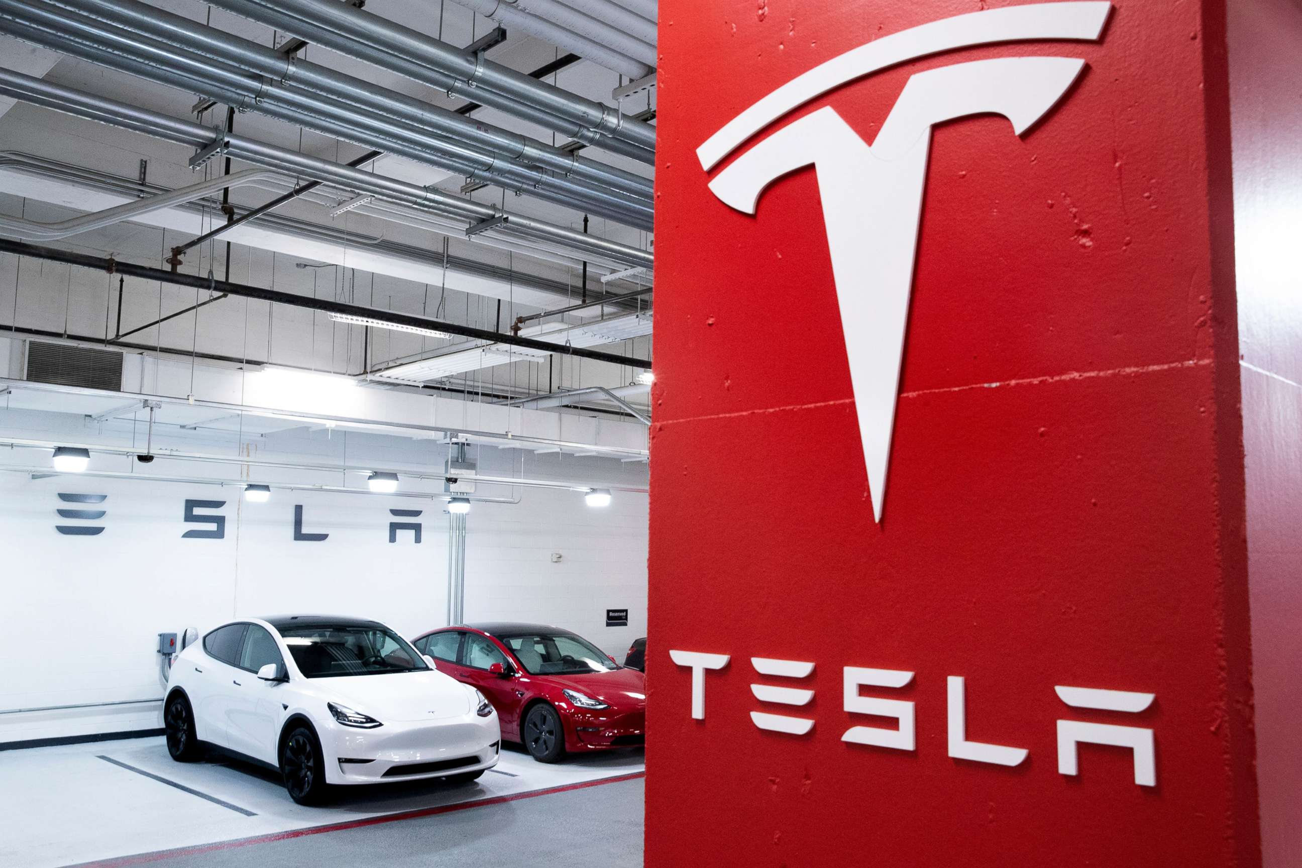 PHOTO: Tesla vehicles are seen charging in a garage in Washington, D.C., Feb. 8, 2021.