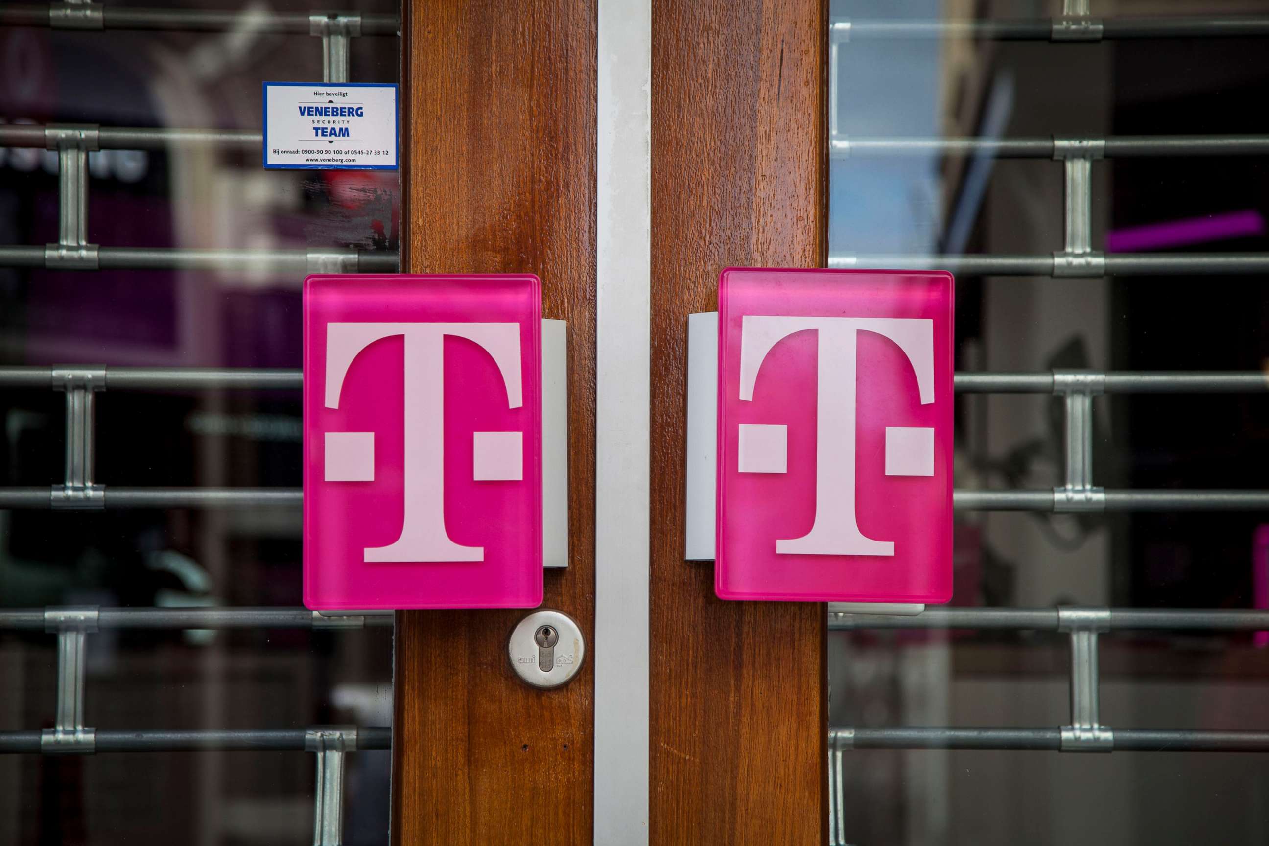 PHOTO: In this April 3, 2020 file photo storefront doors with logo of T-mobile, in Zutphen, Netherlands. 