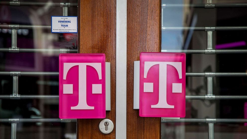 PHOTO: In this April 3, 2020 file photo storefront doors with a logo of T-mobile, in Zutphen, Netherlands. 