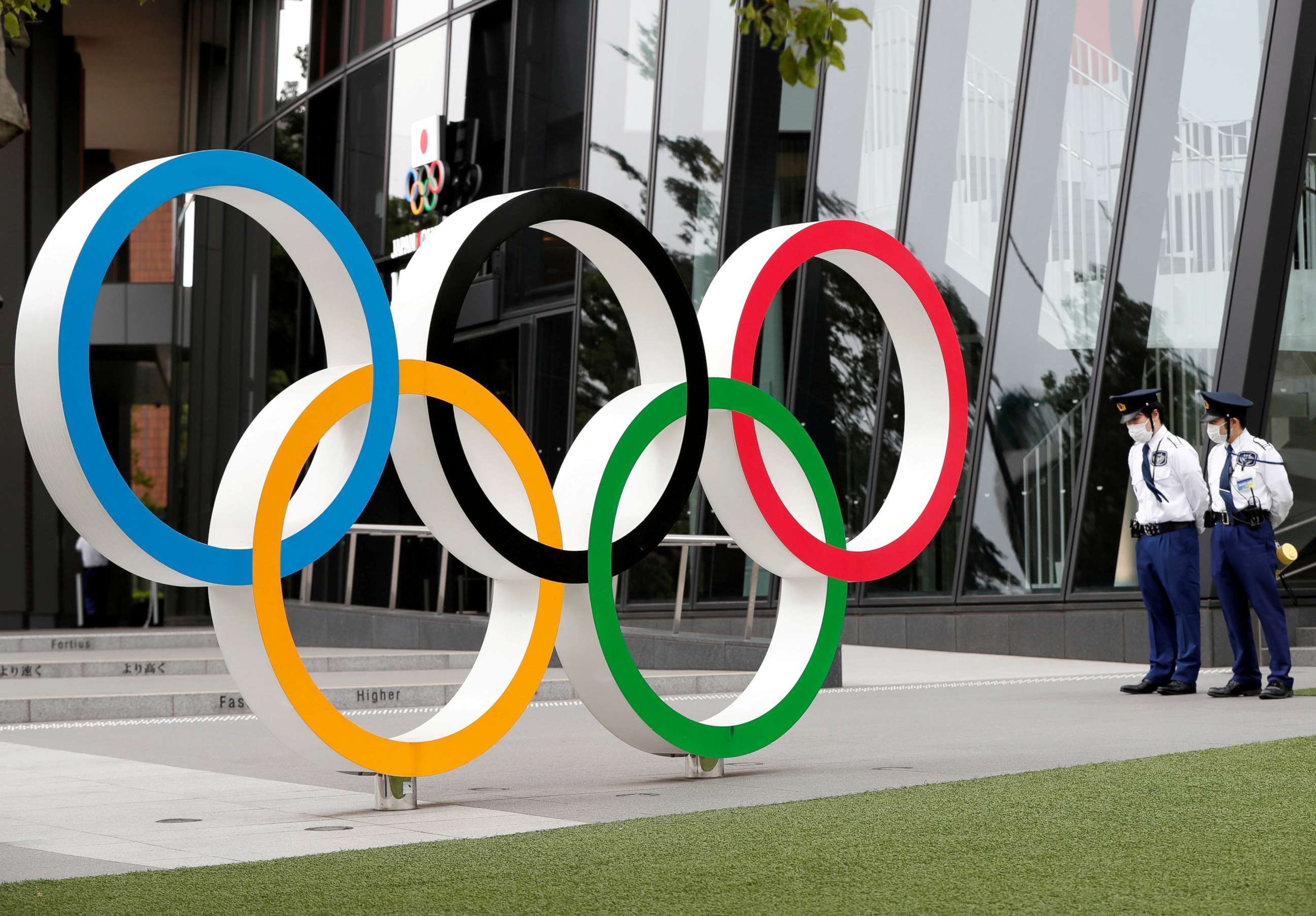 PHOTO: Security personnel stand guard near the Olympic rings monument during a rally by anti-Olympics protesters outside the Japanese Olympic Committee headquarters, in Tokyo, May 18, 2021.