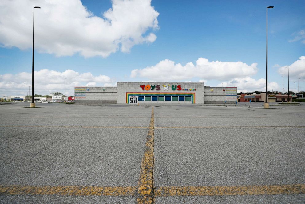 PHOTO: A closed Toys R Us building sits in front of an empty parking lot, Wednesday, May 6, 2020, in Des Moines, Iowa. 