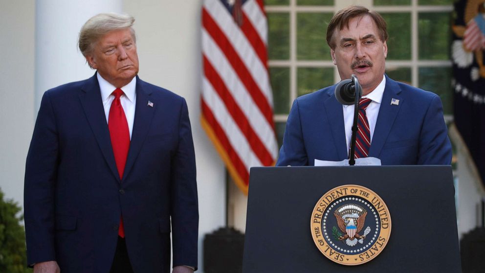 PHOTO: My Pillow CEO Mike Lindell speaks as President Donald Trump listens during a briefing about the coronavirus in the Rose Garden of the White House, in Washington, D.C., March 30, 2020.