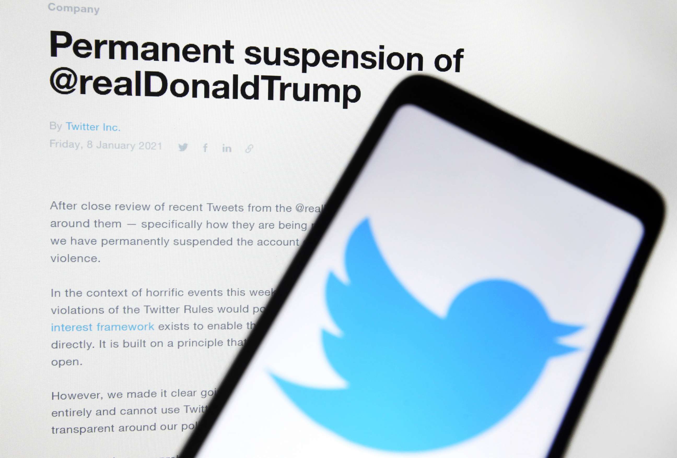 PHOTO: A'Permanent suspension of @realDonaldTrump' message is displayed on a Twitter website in front of a mobile phone with a Twitter logo in a photo illustration, Jan. 11, 2021.