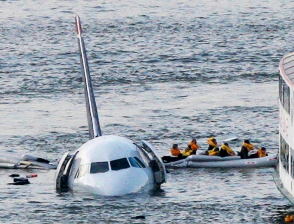 PHOTO: Passengers in an inflatable raft move away from US Airways Flight 1549 that went down in the Hudson River in New York, Jan. 15, 2009.
