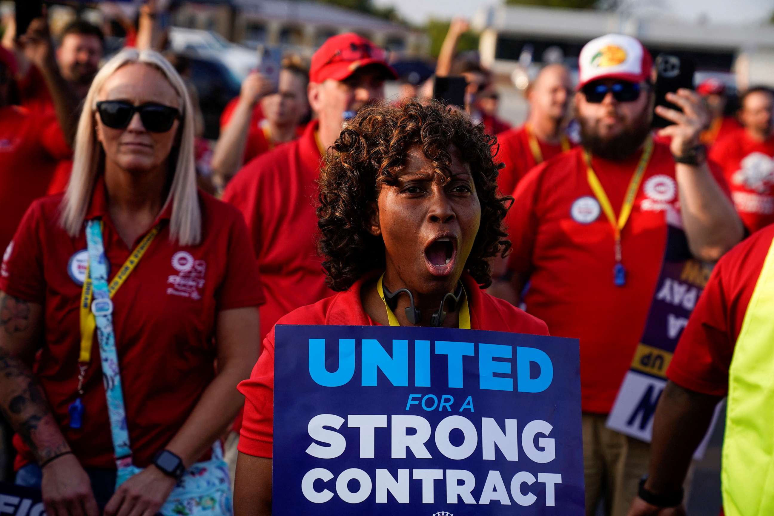 PHOTO: Phaedra Grant, who has worked 34 years for Ford, holds a sign during a United Auto Workers rally to support striking workers outside an assembly plant in Louisville, Kentucky, on Sept. 21, 2023.