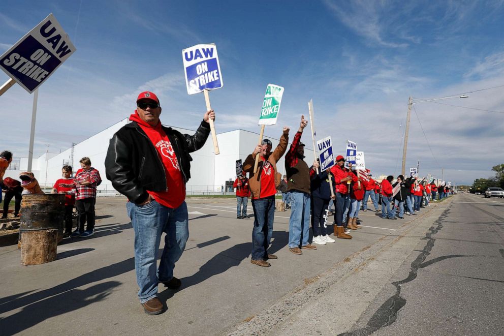 PHOTO: United Auto Workers union members and their families picket at the General Motors Flint Assembly plant on Solidarity Sunday on Oct. 13, 2019, in Flint, Michigan.