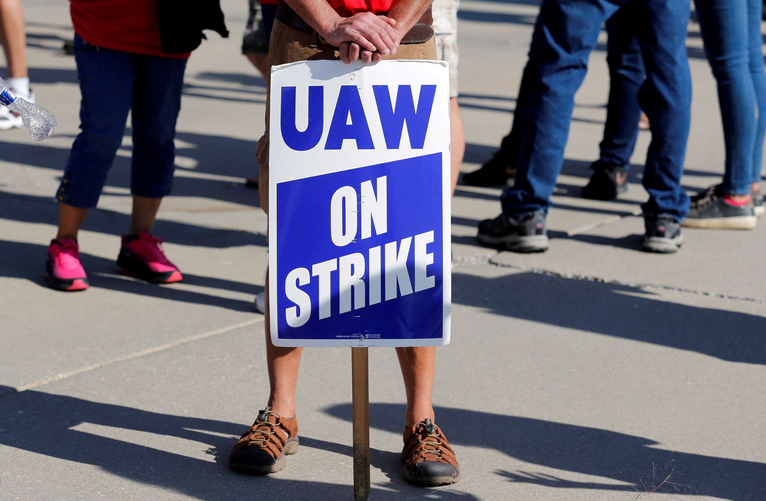 PHOTO: A striking worker holds a sign outside the shuttered General Motors Lordstown Assembly plant during the United Auto Workers national strike in Lordstown, Ohio, Sept. 20, 2019.