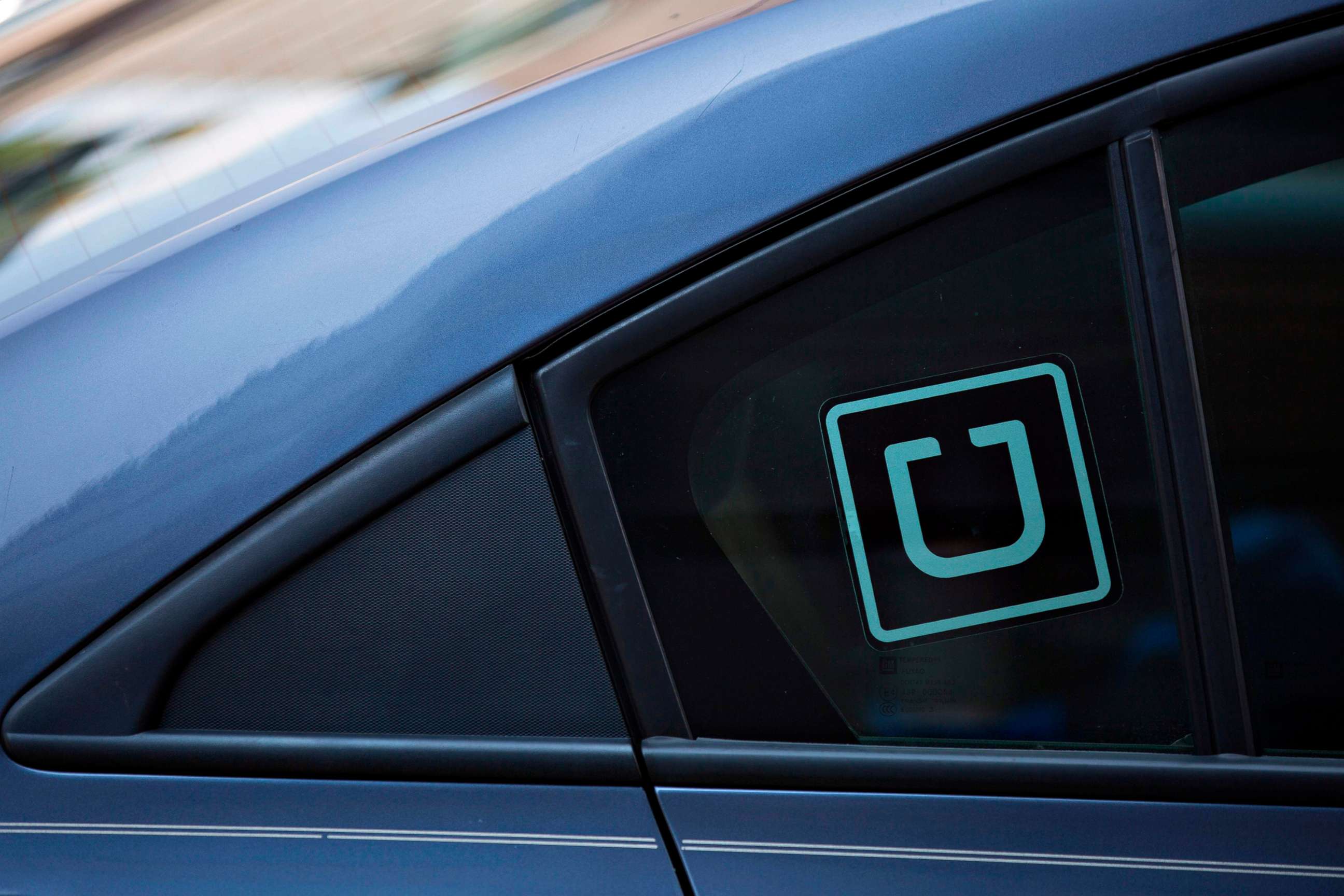 PHOTO: Uber logo on a car.