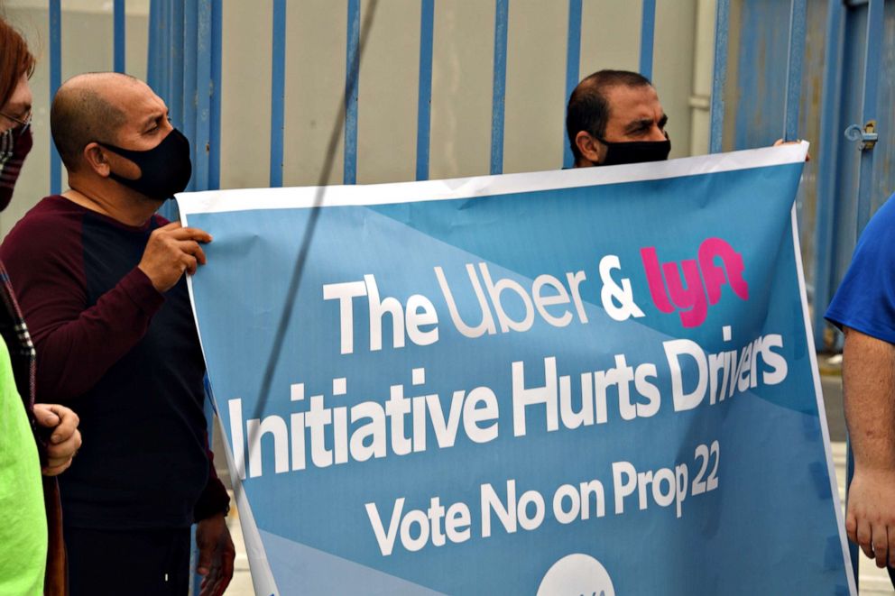 PHOTO: Rideshare drivers demonstrate against rideshare companies Uber and Lyft during a car caravan protest on Aug. 6, 2020, in Los Angeles.