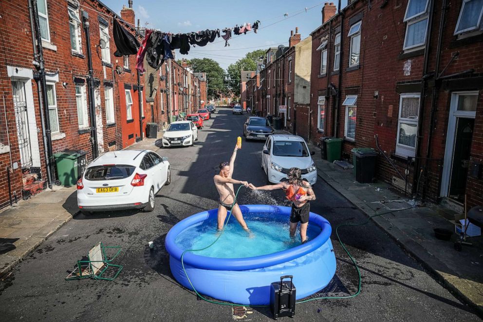 PHOTO: Residents take a dip in a pool to cool off during a heatwave, July 19, 2022, in Leeds, U.K.