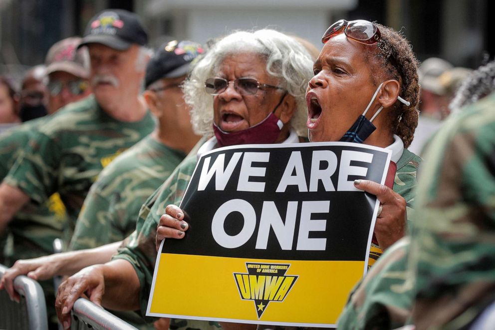 PHOTO: Members of United Mine Workers of America (UMWA) and other labor leaders picket for the union's strike at Warrior Met Coal Mine, outside BlackRock's Headquarters in New York City, July 28, 2021.