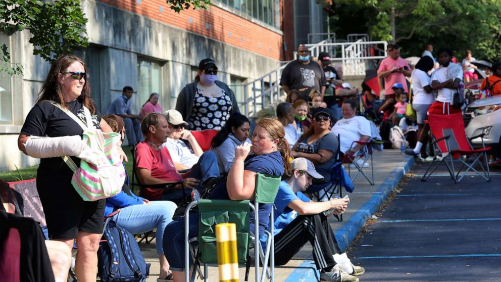 PHOTO: Hundreds of unemployed Kentucky residents wait in long lines outside the Kentucky Career Center for help with their unemployment claims, June 19, 2020, in Frankfort, Ky.