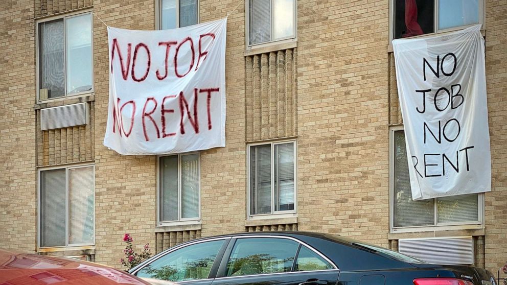 PHOTO: Banners against renters eviction reading "no job, no rent" are displayed on a building in Washington, D.C., Aug. 9, 2020.