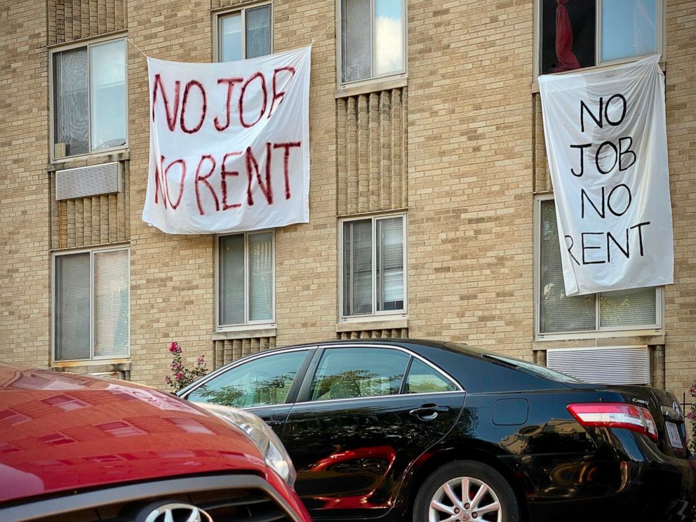 PHOTO: Banners against renters eviction reading "no job, no rent" are displayed on a building in Washington, D.C., Aug. 9, 2020.