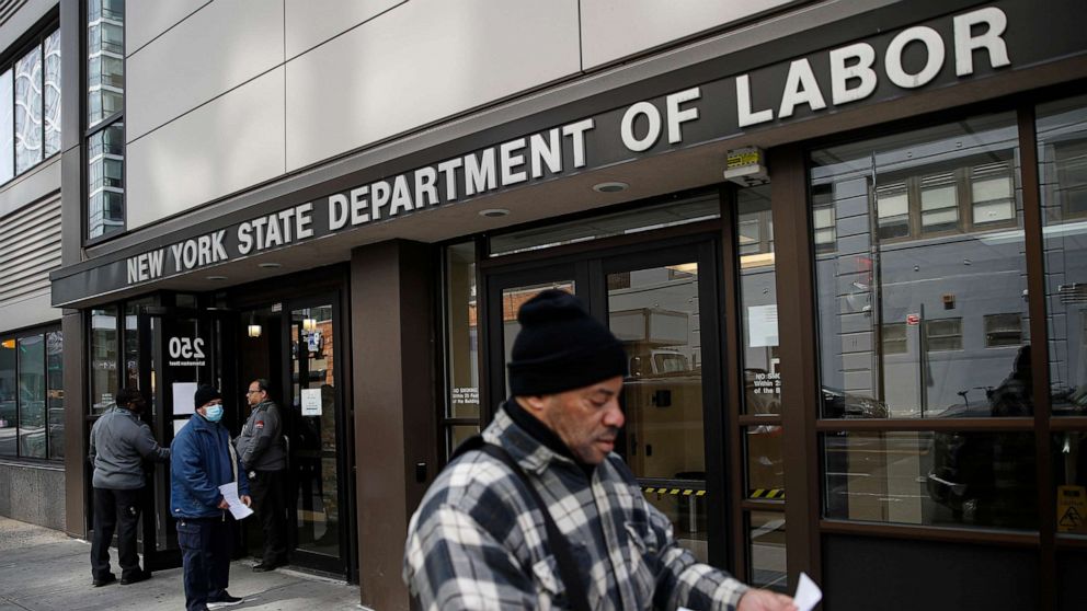 PHOTO: Visitors to the Department of Labor are turned away at the door by personnel due to closures over coronavirus concerns in New York, March 18, 2020. 