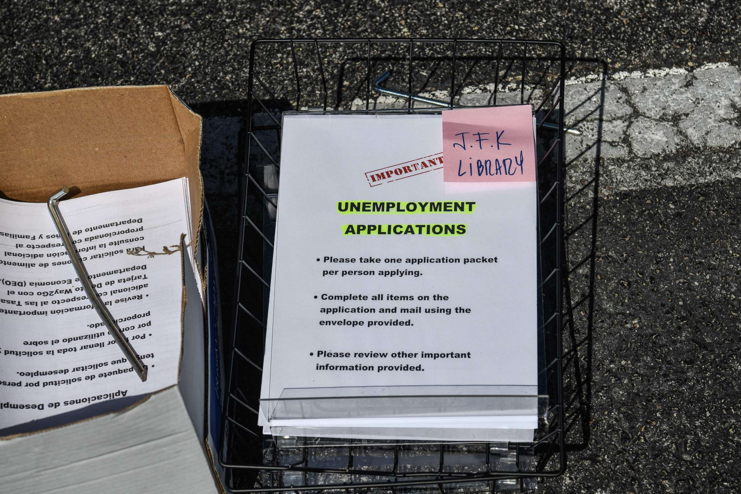 PHOTO: In this file photo taken on April 8, 2020, unemployment forms are kept at a drive through collection point outside the John F. Kennedy Library in Hialeah, Fla.