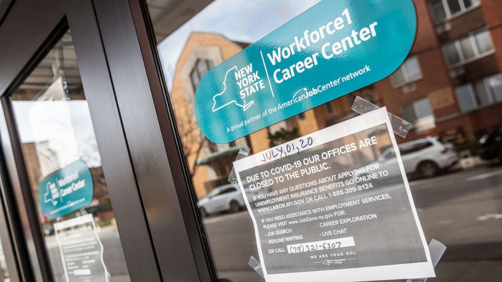 PHOTO: Signage is displayed on a closed New York State Department of Labor building in Queens, N.Y. on April 14, 2020.
