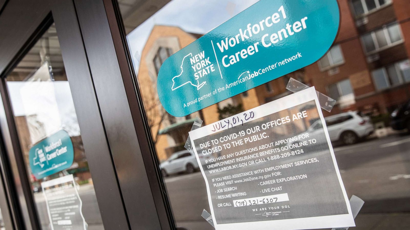 PHOTO: Signage is displayed on a closed New York State Department of Labor building in Queens, N.Y. on April 14, 2020.