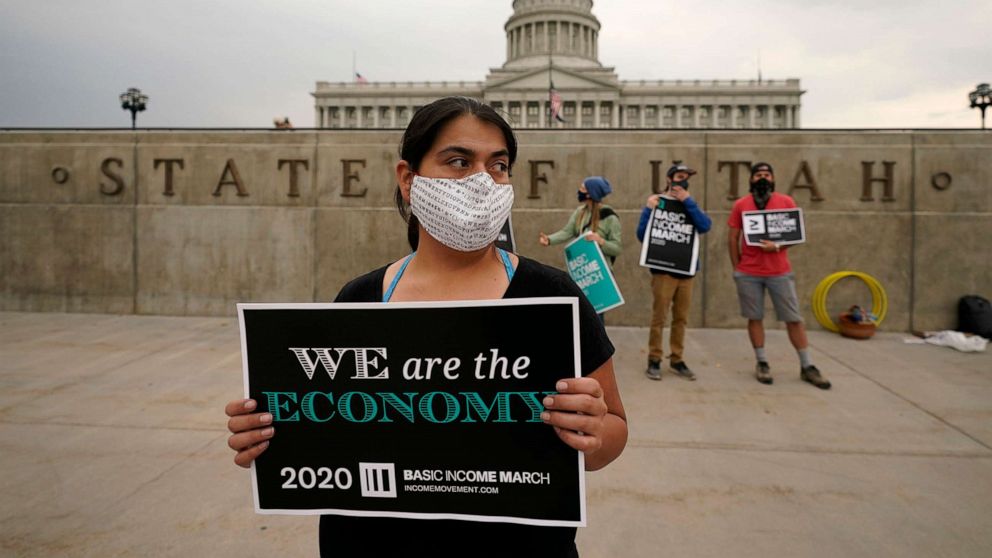 PHOTO:Brenda Milian gathers with other showing their support for the 2020 Basic Income March at the Utah State Capitol on Saturday, Sept. 19, 2020, in Salt Lake City.