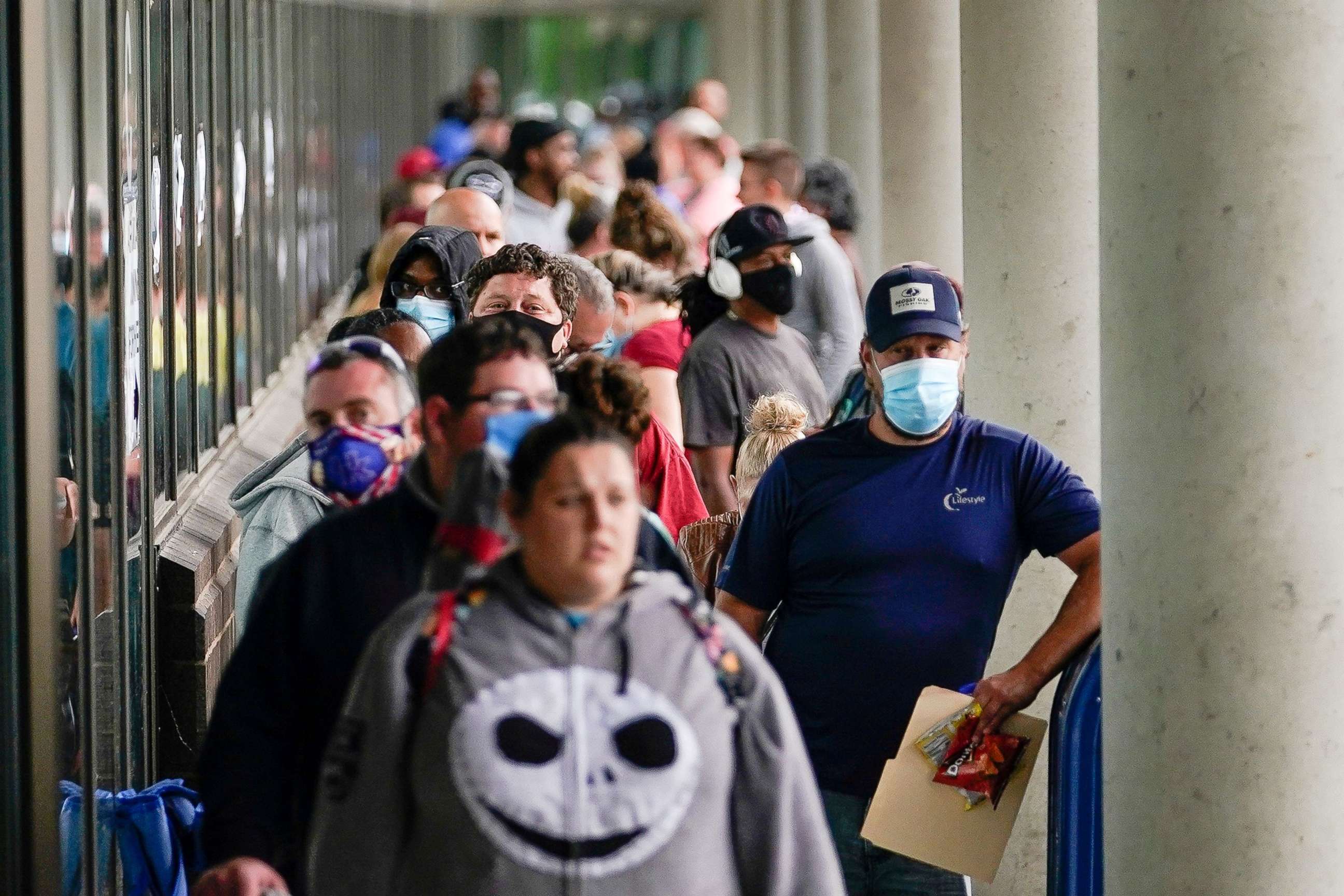 PHOTO: Hundreds of people line up outside a Kentucky Career Center hoping to find assistance with their unemployment claim in Frankfort, Kentucky, June 18, 2020.