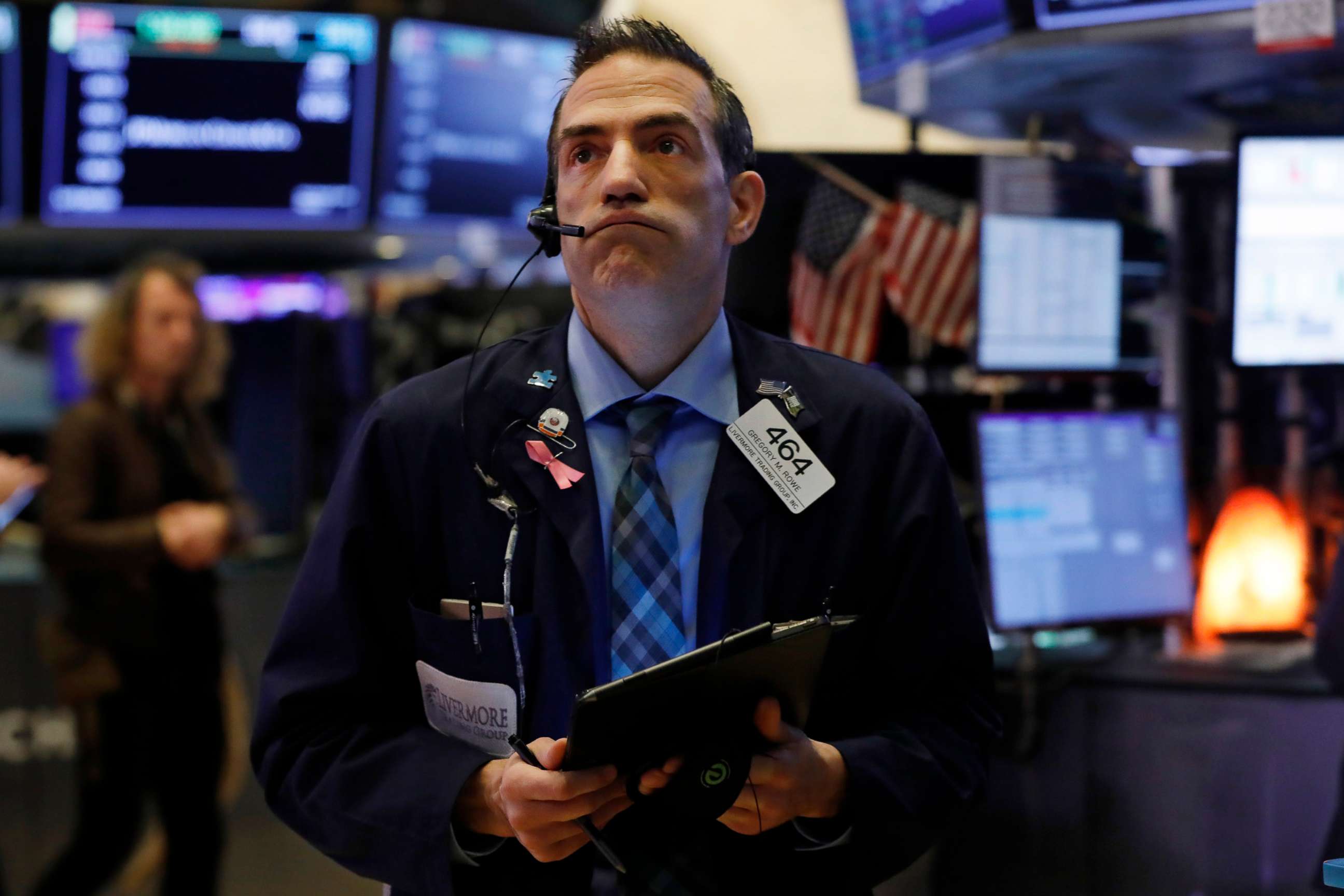 PHOTO: Trader Gregory Rowe works on the floor of the New York Stock Exchange, March 6, 2020.