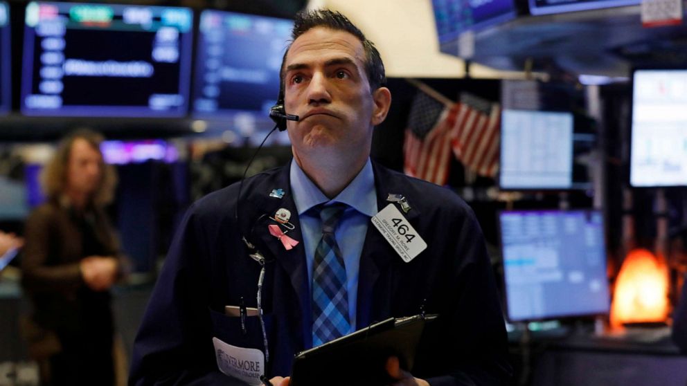 PHOTO: Trader Gregory Rowe works on the floor of the New York Stock Exchange, March 6, 2020.