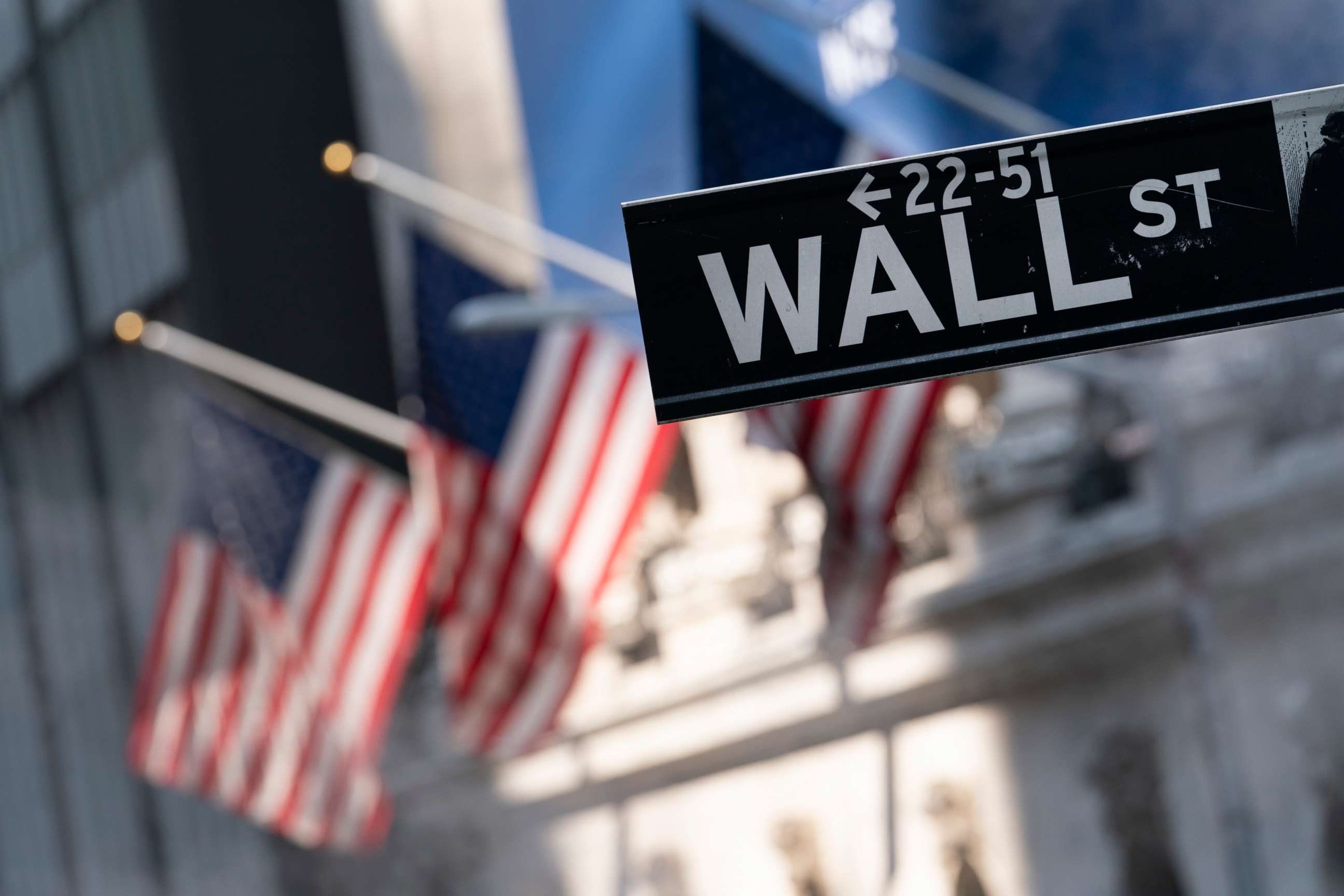 PHOTO: A sign for Wall Street hangs in front of the New York Stock Exchange, on July 8, 2021. Stocks are opening lower on Wall Street Thursday, June 9, 2022, putting major indexes into the red for the week.