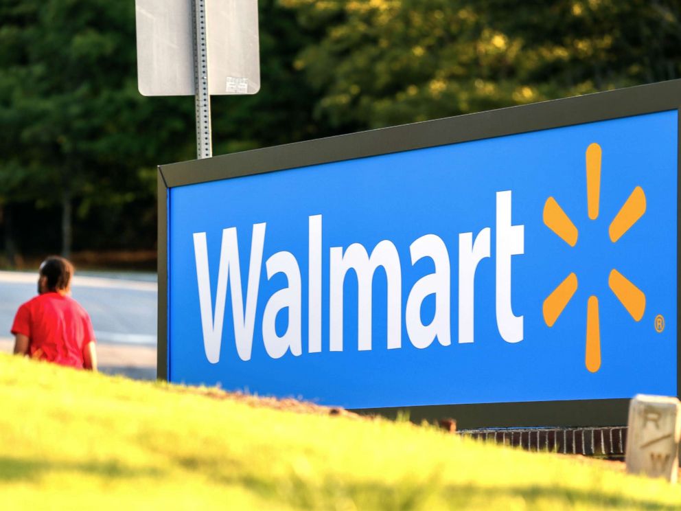 PHOTO: A man walks by the entrance to a Walmart store in Decatur, G.a., on Aug. 27, 2015.