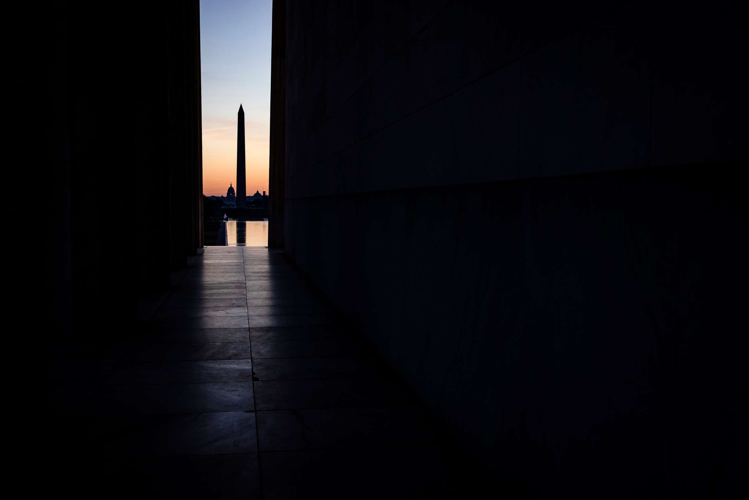 PHOTO: The U.S. Capitol Building and Washington Monument are seen across the National Mall from the Lincoln Memorial as the sun rises on Dec. 27, 2020 in Washington, D.C.
