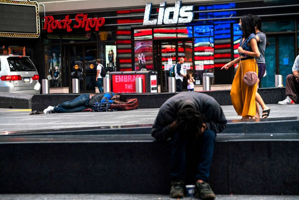 PHOTO: Unhoused persons rest in Times Square on Aug. 8, 2020 in New York City. 
