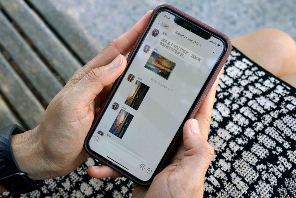 PHOTO: Sha Zhu shows the app WeChat on her phone, which she uses to keep in touch with family and friends in the U.S. and China, Aug. 18, 2020, in Washington, DC.