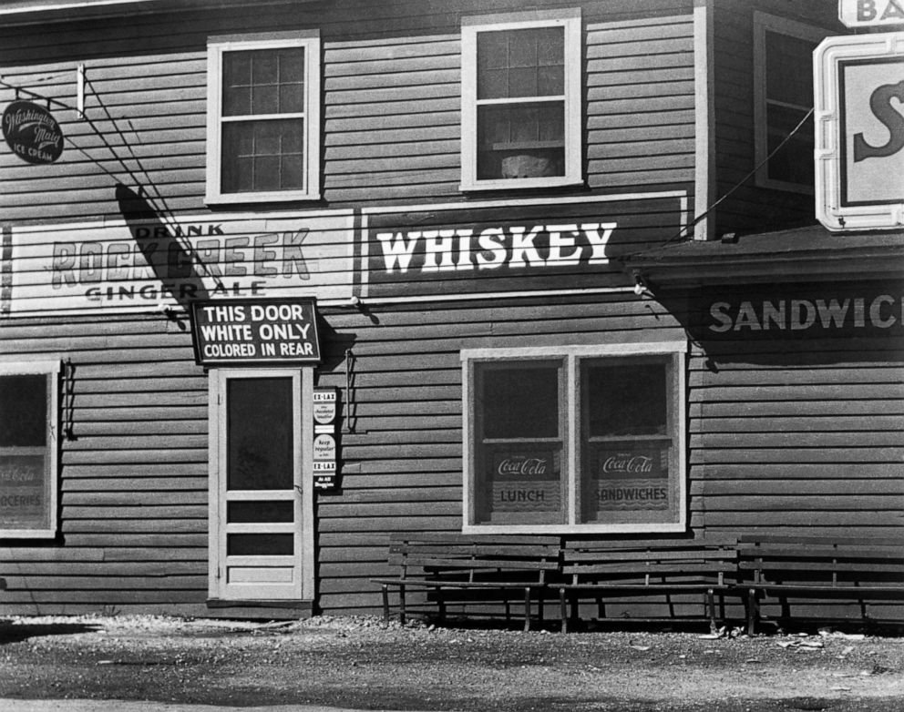 PHOTO: A restaurant in Maryland has a sign over its front entrance designating it "white only" and telling African Americans that they must enter the establishment through the rear door, circa. 1948.