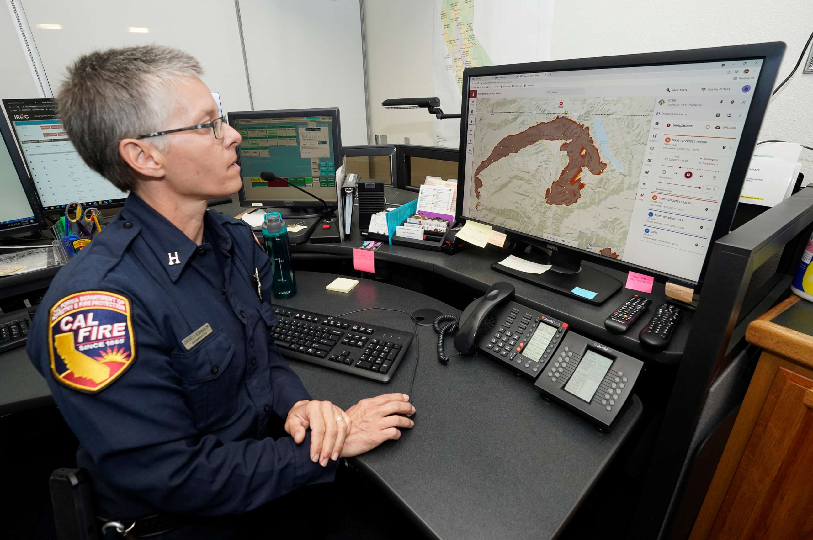 PHOTO: In this July 23, 2021, file photo, Cal Fire Capt. Danell Eshnaur uses the Fire Response Tactical Analyst program to help pre-position fire fighting resources on the Dixie Fire at the Cal Fire's Sacramento Command Center in Rancho Cordova, Calif.