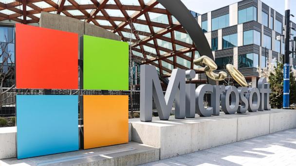 FILE - A Microsoft sign and logo are pictured at the company's headquarters, Friday, April 4, 2025, in Redmond, Wash. (AP Photo/Jason Redmond, File)