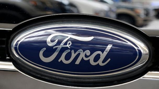 FILE - This Photo taken Feb. 14, 2013 shows a Ford logo at the 2013 Pittsburgh Auto Show in Pittsburgh. (AP Photo/Gene J. Puskar, File)