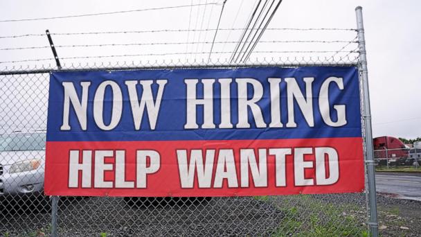 A now hiring and help wanted sign is posted in Morrisville, Pa., Monday, June 9, 2025. (AP Photo/Matt Rourke)