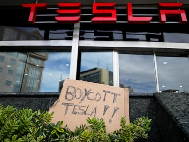 Trump says he's going to buy a Tesla as more Americans say they won't