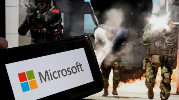 FILE - The logo for Microsoft, and a scene from Activision "Call of Duty - Modern Warfare," are shown in this photo, in New York, Wednesday, June 21, 2023. (AP Photo/Richard Drew, File)