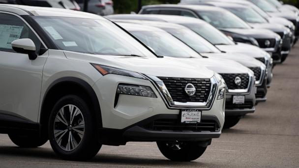FILE - Unsold 2021 Rogue sports-utility vehicles sit on a lot at a Nissan dealership Colorado on June 27, 2021. (AP Photo/David Zalubowski, File)