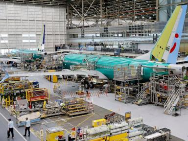 Boeing names its next CEO while posting a quarterly loss of more than $1.4 billion